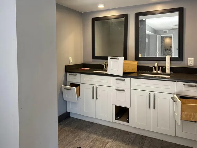 an empty room with fan and entryway