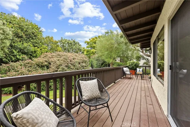 a view of balcony with furniture