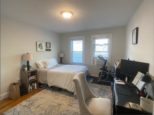 a bedroom with a bed and chair