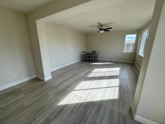 a view of hallway with wooden floor