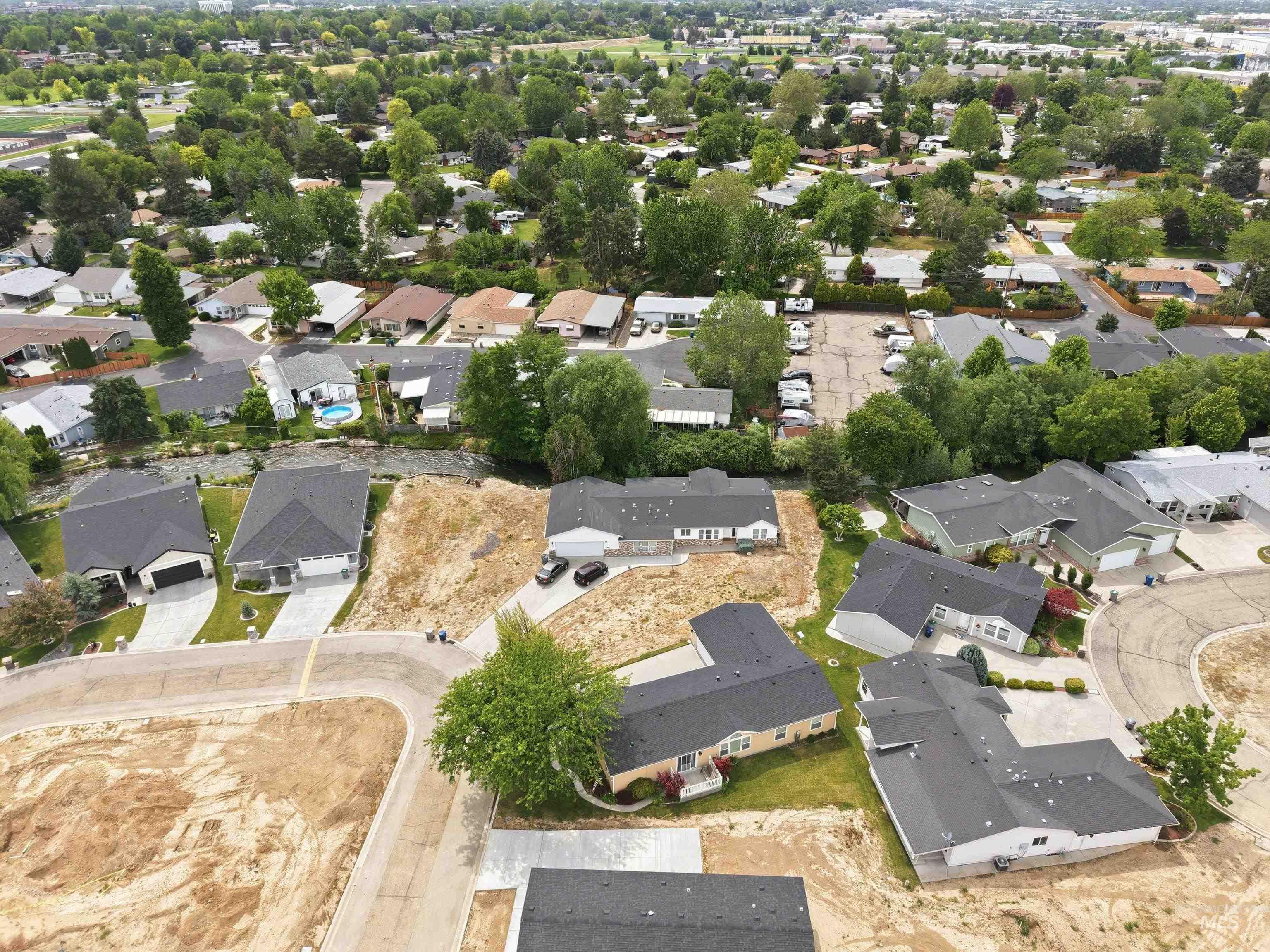 421 South Curtis Road, Unit 202 202 Boise, ID 83705 - Photo 30 of 41 Aerial perspective showcasing established residential areas with mature trees and recently developed parcels with new construction