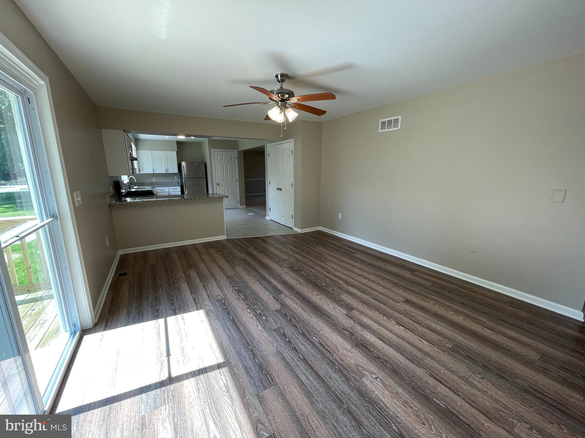 2151 Carrs Mill Road Fallston, MD 21047 - Photo 11 of 35 a view of a livingroom with a ceiling fan and window