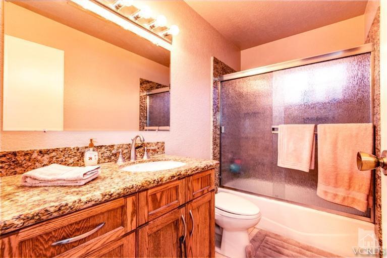 2273 Keystone Street Simi Valley, CA 93063 - Photo 19 of 29 a bathroom with a granite countertop sink toilet and shower