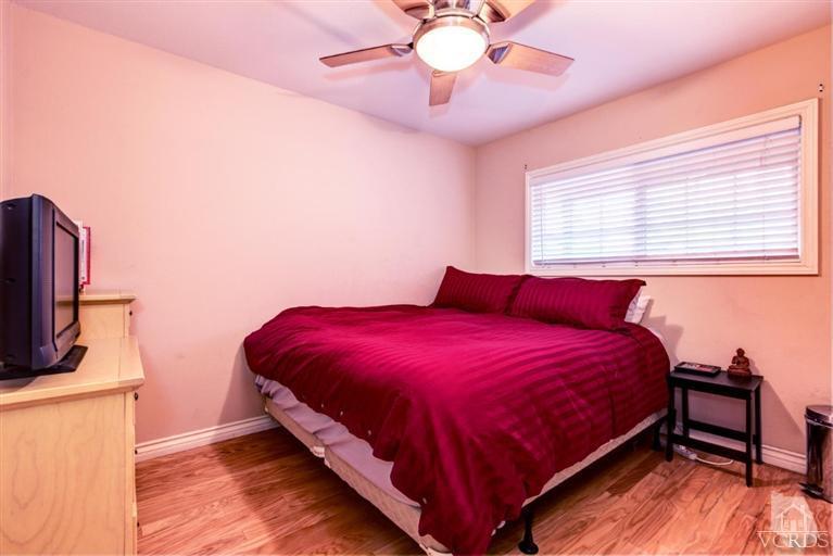 2273 Keystone Street Simi Valley, CA 93063 - Photo 21 of 29 a bedroom with a bed and a flat screen tv