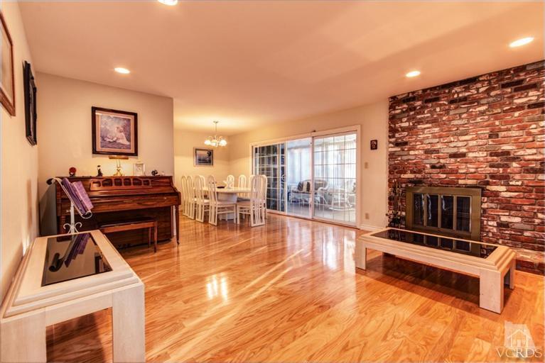 2273 Keystone Street Simi Valley, CA 93063 - Photo 4 of 29 a living room with furniture stove and wooden floor