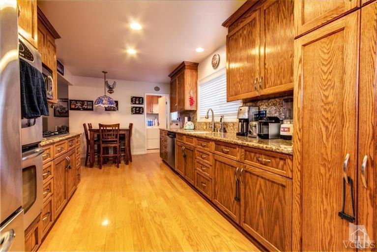2273 Keystone Street Simi Valley, CA 93063 - Photo 7 of 29 a kitchen with stainless steel appliances a sink and cabinets