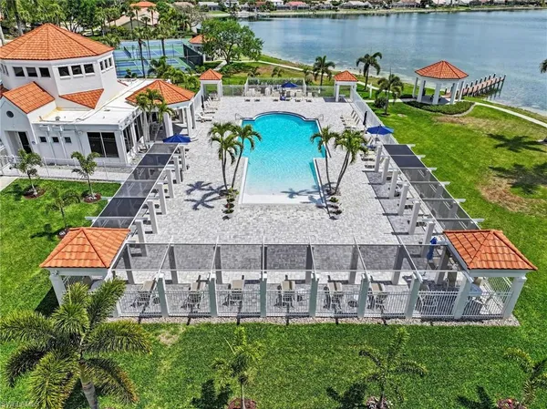 an aerial view of a house with garden space and street view
