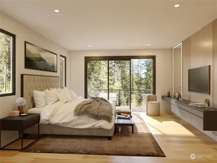 a bedroom with a bed and large window