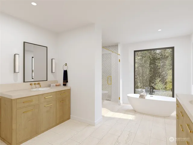 a spacious bathroom with a tub sink and mirror