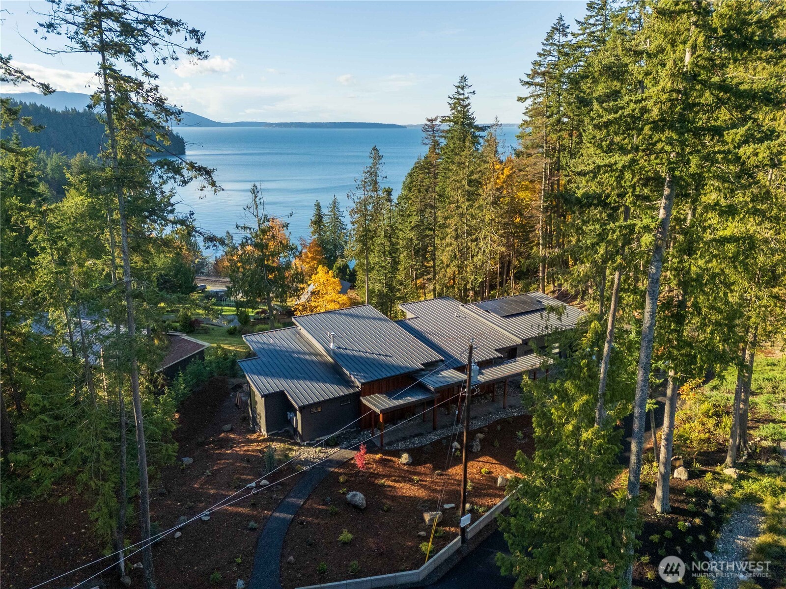 166 Soundview Road Bellingham, WA 98229 - Photo 4 of 21 a view of a patio with table and chairs and potted plants