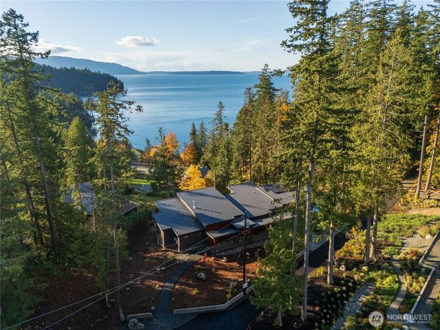 a view of a chairs and table in the balcony