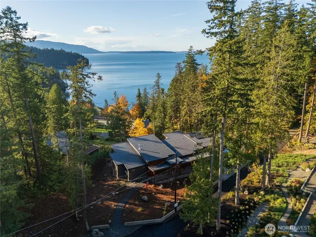 a view of a chairs and table in the balcony