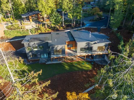 a view of a patio with table and chairs potted plants