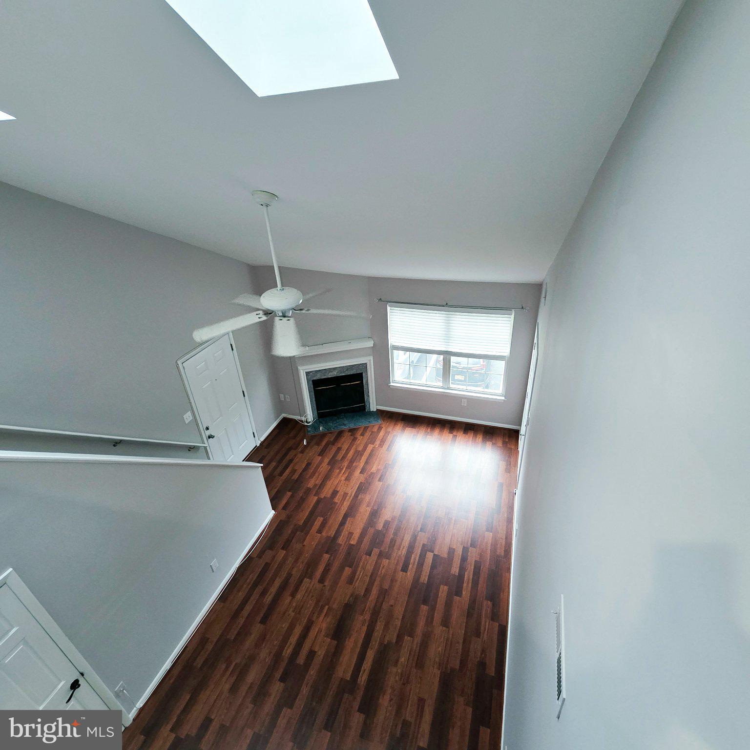 208 Ashley Run Voorhees, NJ 08043 - Photo 7 of 23 a view of empty room with a fireplace and wooden floor