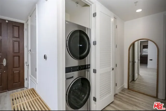 a view of a hallway with washer and dryer