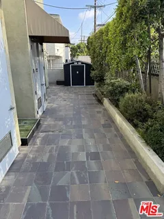 a view of a chairs and table in a patio