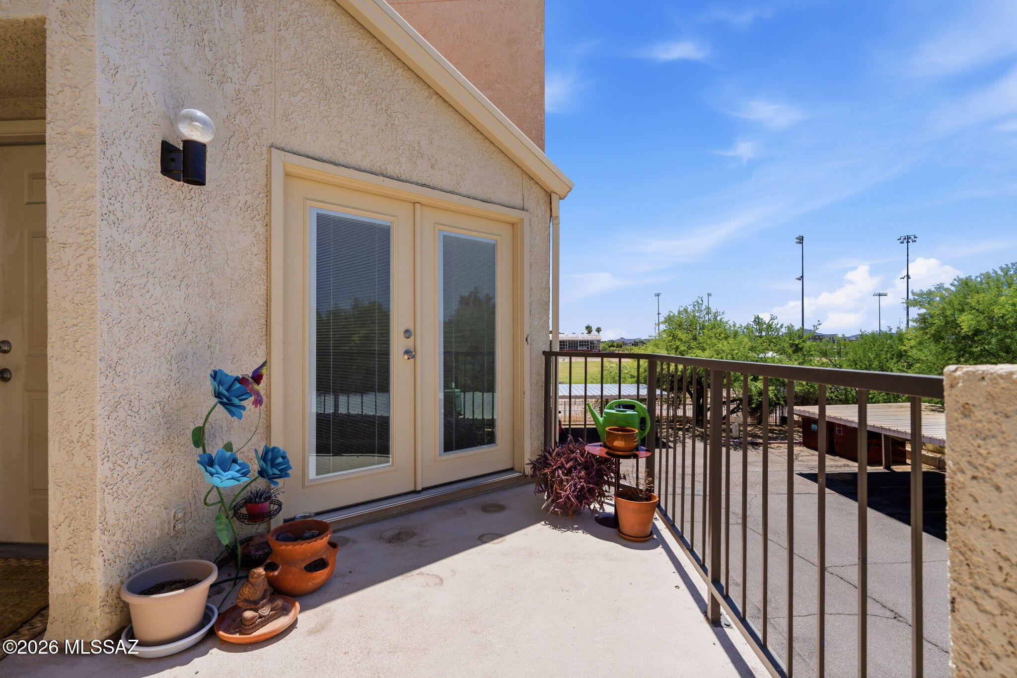 1200 East River Road, Unit G87 Tucson, AZ 85718 - Photo 25 of 30 a view of a balcony with potted plants