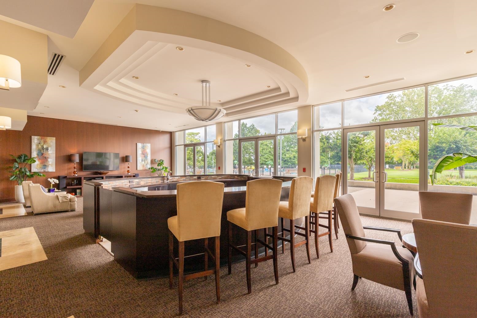 655 Riverside Drive, Unit 406B Memphis, TN 38103 - Photo 5 of 24 a view of a dining room with furniture large windows and wooden floor