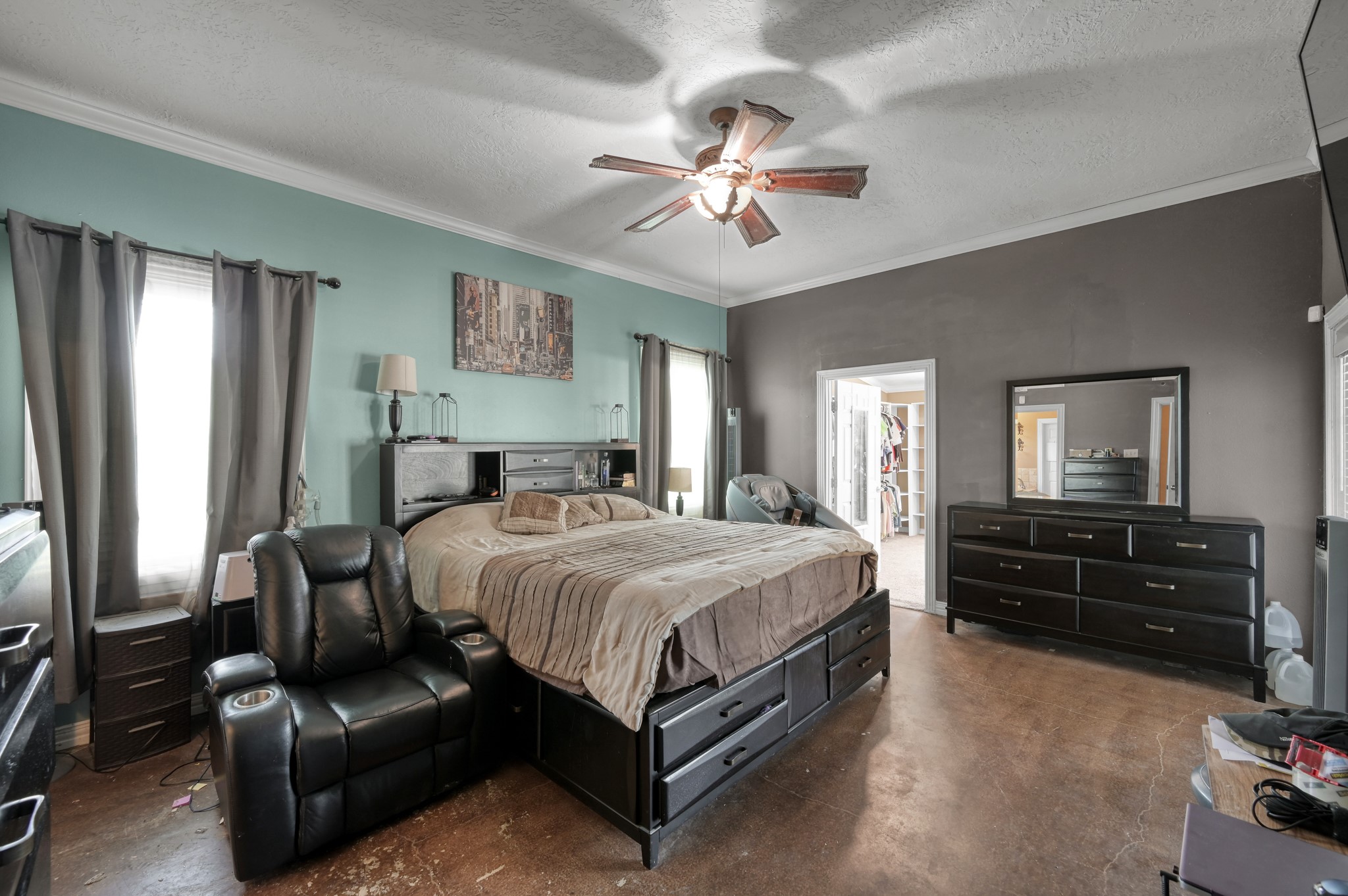 144 Wood Farm Road Huntsville, TX 77320 - Photo 12 of 35 a bedroom with a bed and ceiling fan