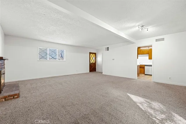 a view of empty room with windows