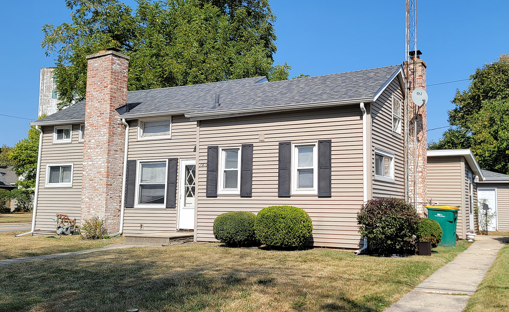 14821 South Bartlett Avenue, Unit 102 Plainfield, IL 60544 - Photo 1 of 14 a view of a house with a yard