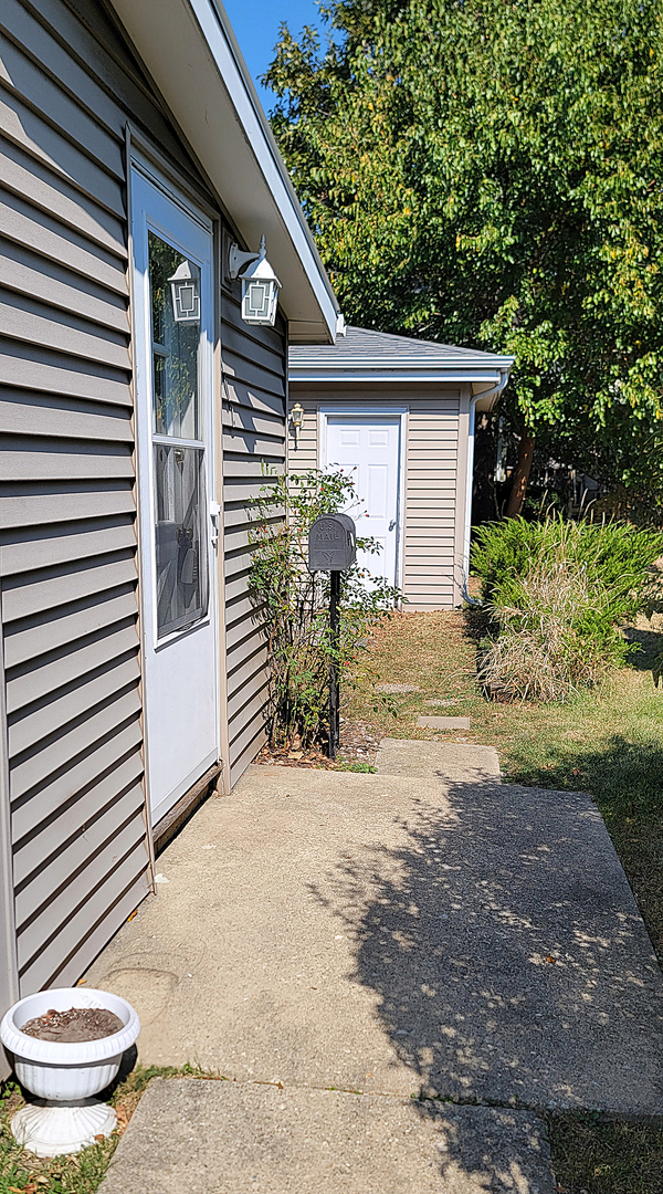 14821 South Bartlett Avenue, Unit 102 Plainfield, IL 60544 - Photo 13 of 14 a view of a back yard of the house