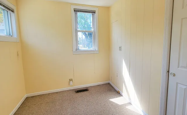 an empty room with windows