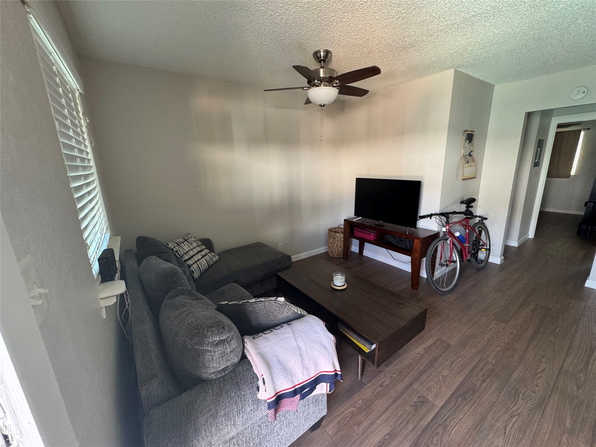 2401 Manor Road, Unit 118 Austin, TX 78722 - Photo 3 of 10 a living room with furniture and a flat screen tv