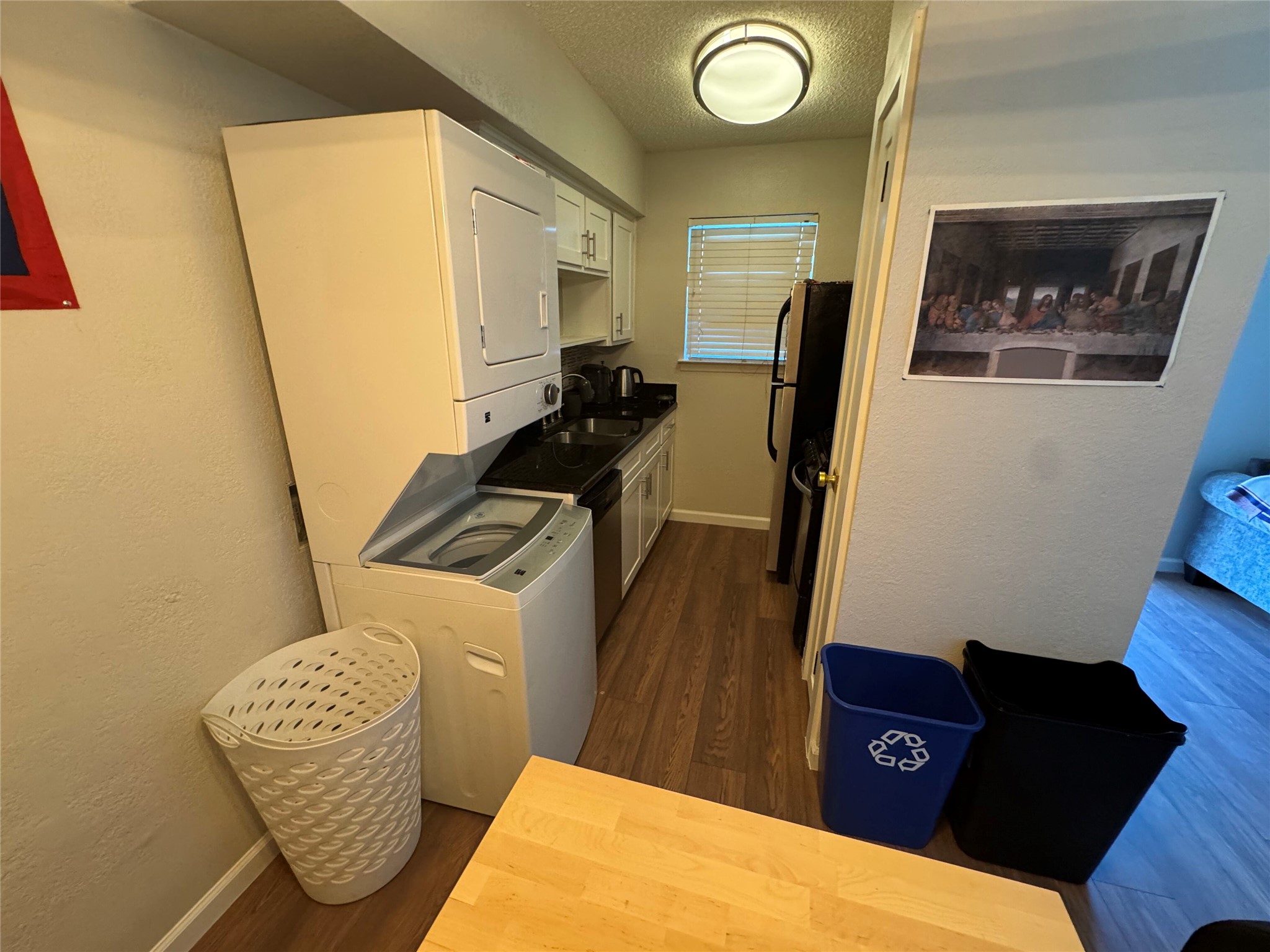 2401 Manor Road, Unit 118 Austin, TX 78722 - Photo 5 of 10 a view of kitchen with wooden floor