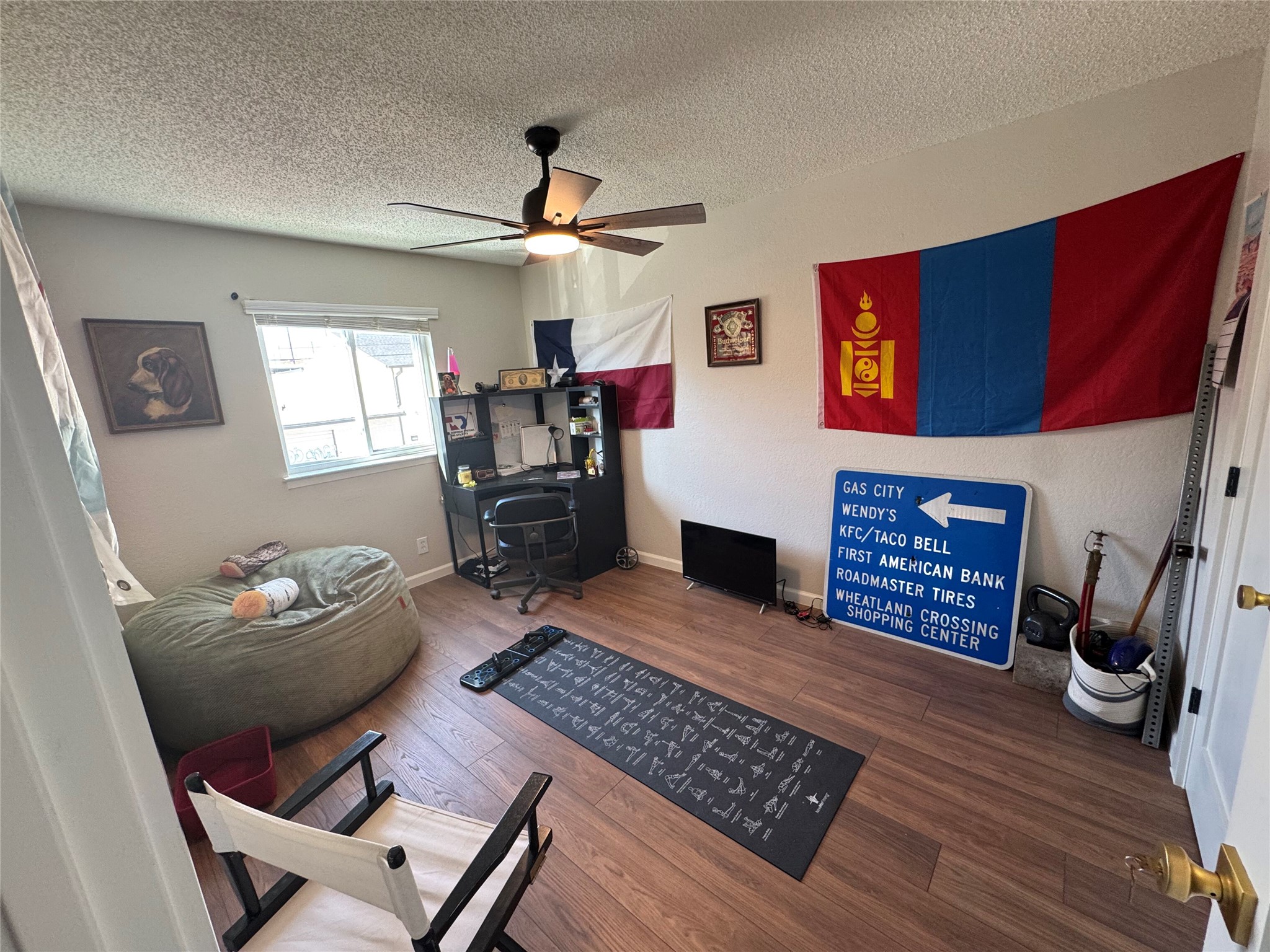 2401 Manor Road, Unit 118 Austin, TX 78722 - Photo 6 of 10 a living room with furniture and a fireplace