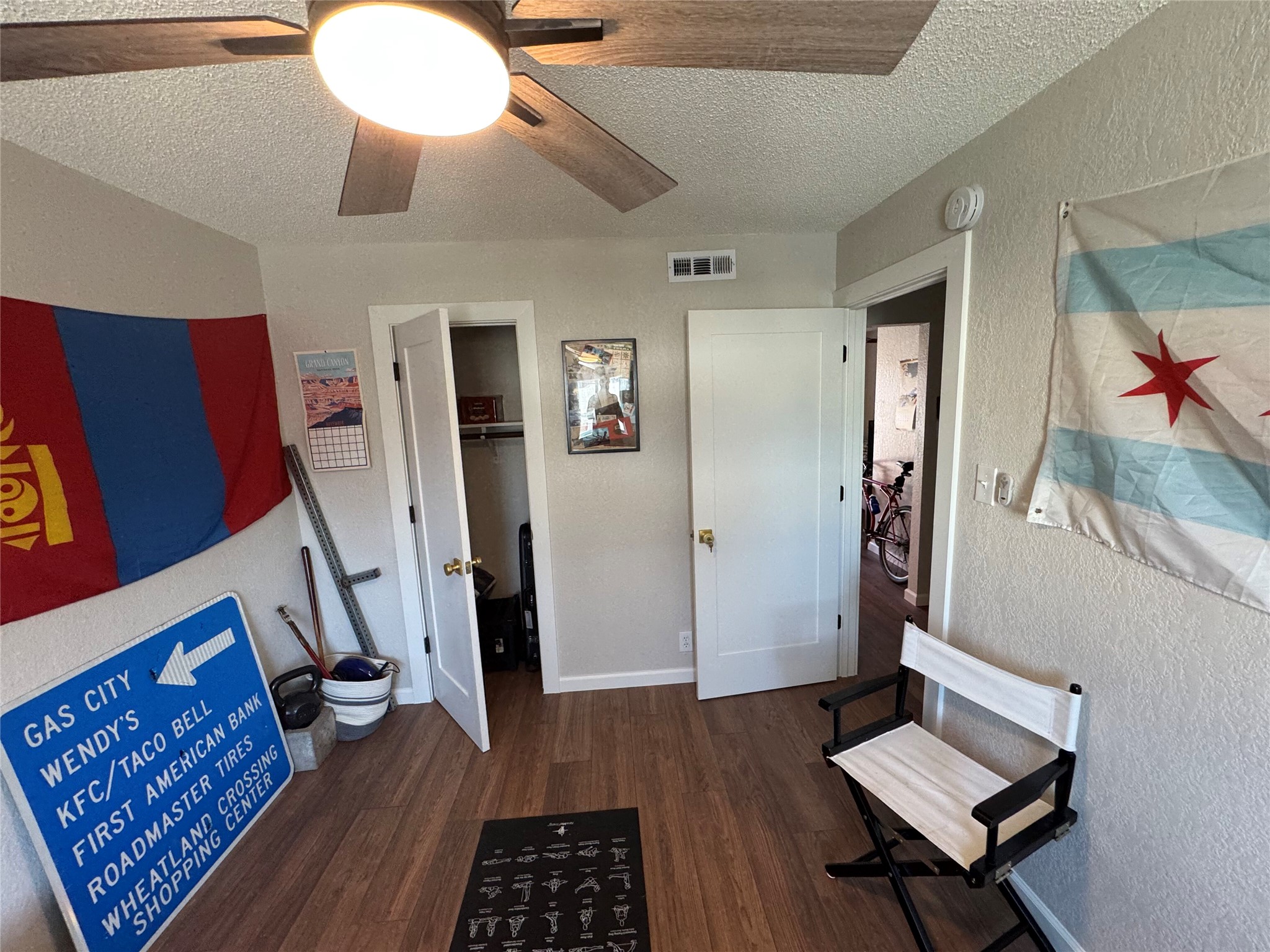 2401 Manor Road, Unit 118 Austin, TX 78722 - Photo 7 of 10 a living room with furniture and a rug