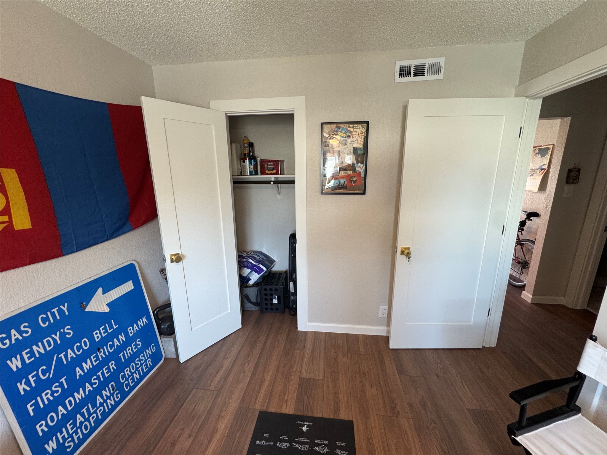 2401 Manor Road, Unit 118 Austin, TX 78722 - Photo 8 of 10 a view of livingroom with hardwood floor and a ceiling fan