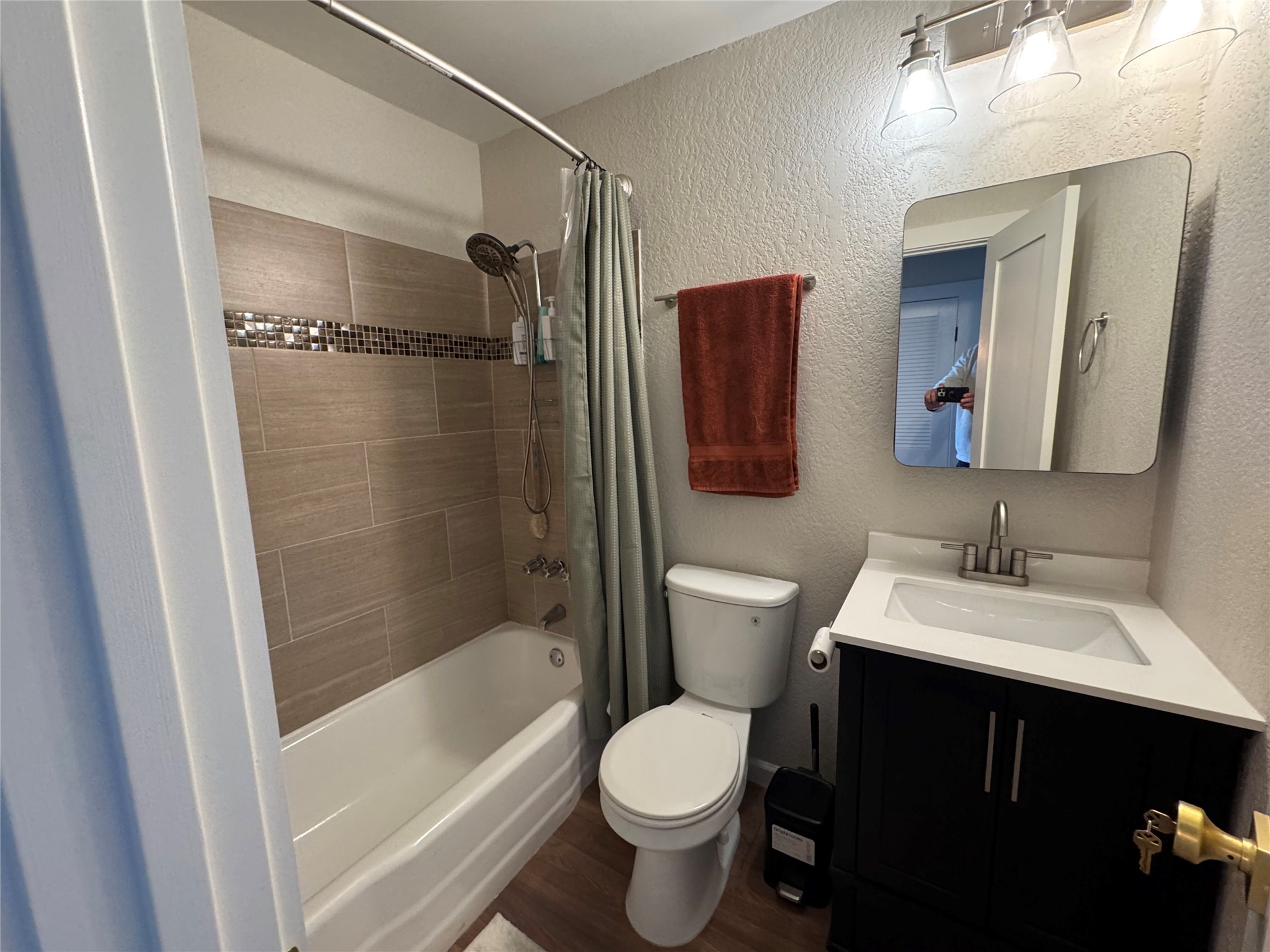 2401 Manor Road, Unit 118 Austin, TX 78722 - Photo 9 of 10 a bathroom with a sink toilet and shower