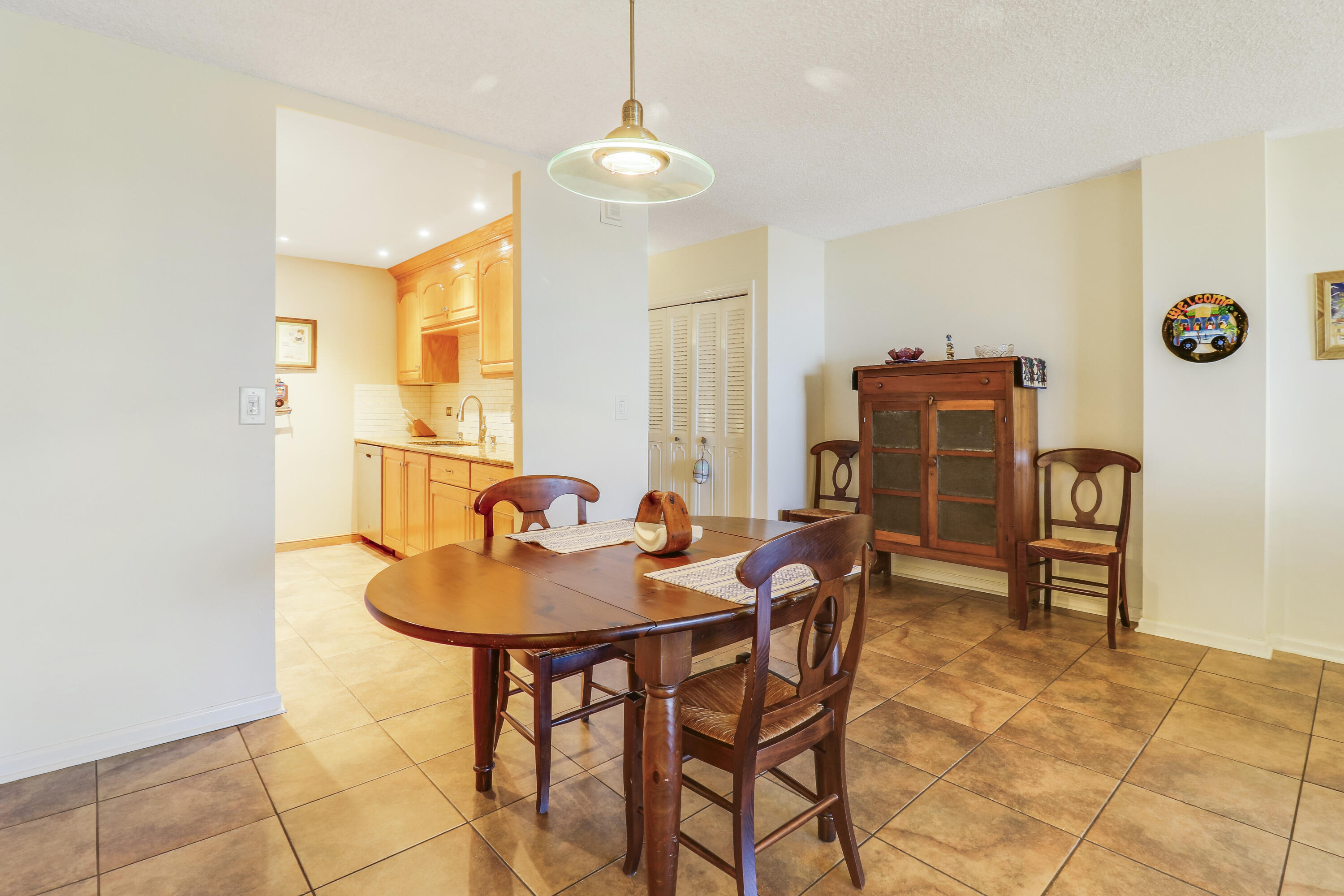 1200 Marine Way, Unit 607 North Palm Beach, FL 33408 - Photo 13 of 53 a dining room with furniture and window
