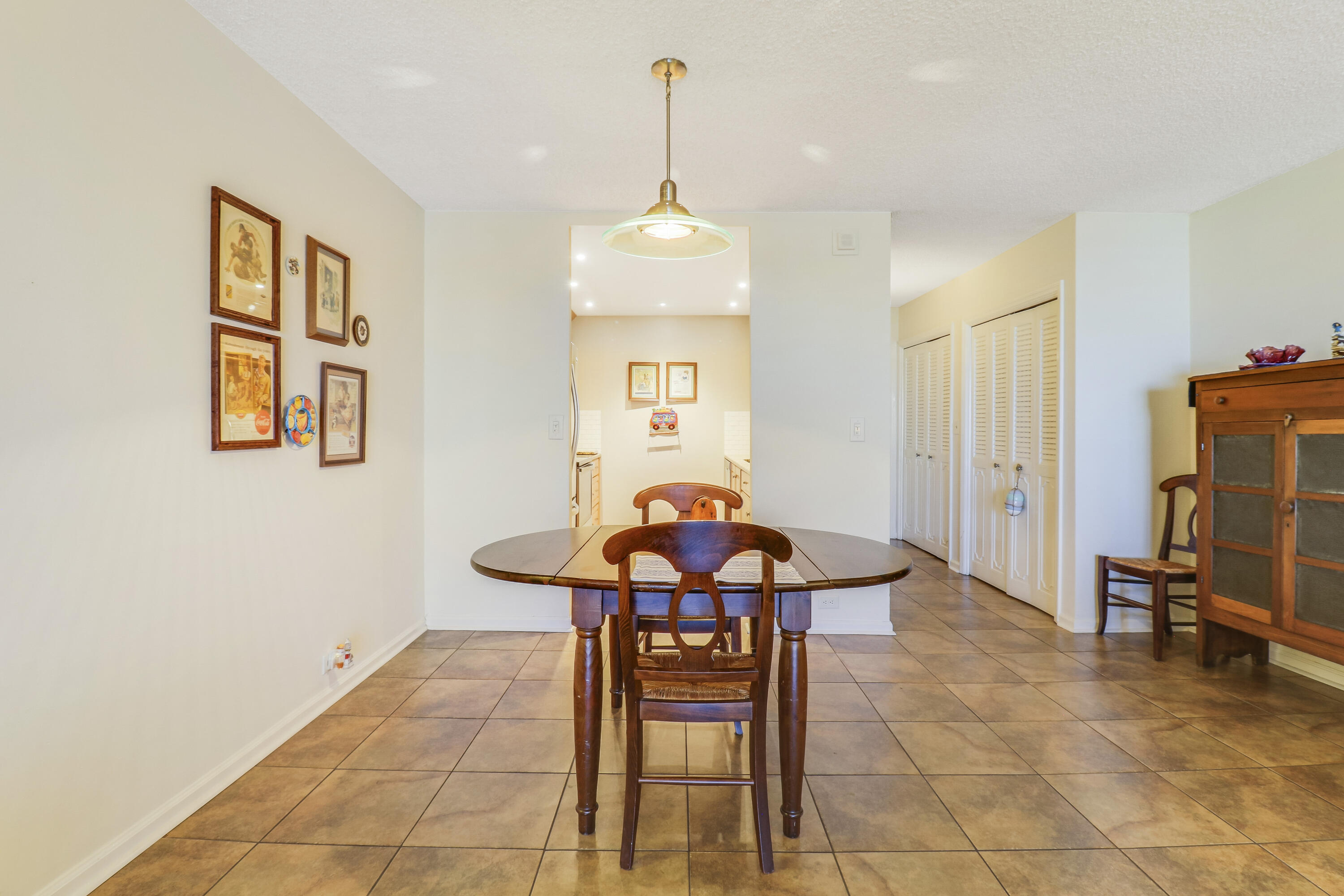 1200 Marine Way, Unit 607 North Palm Beach, FL 33408 - Photo 14 of 53 a dining room with furniture and window
