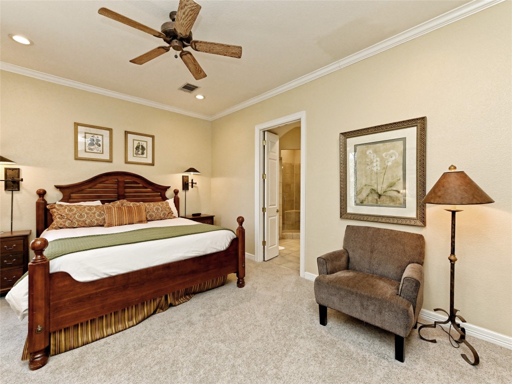 8212 Barton Club Drive, Unit 910 Austin, TX 78735 - Photo 15 of 26 a bedroom with a bed and a couch