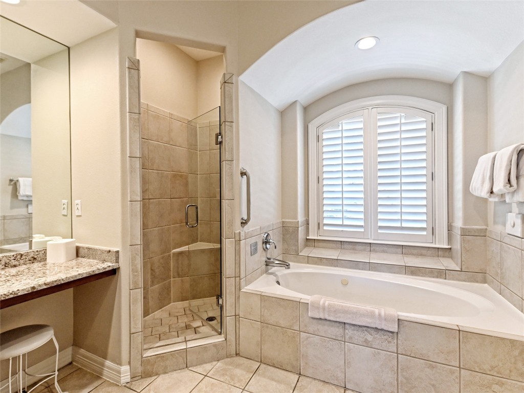 8212 Barton Club Drive, Unit 910 Austin, TX 78735 - Photo 17 of 26 a bathroom with a bathtub and a sink