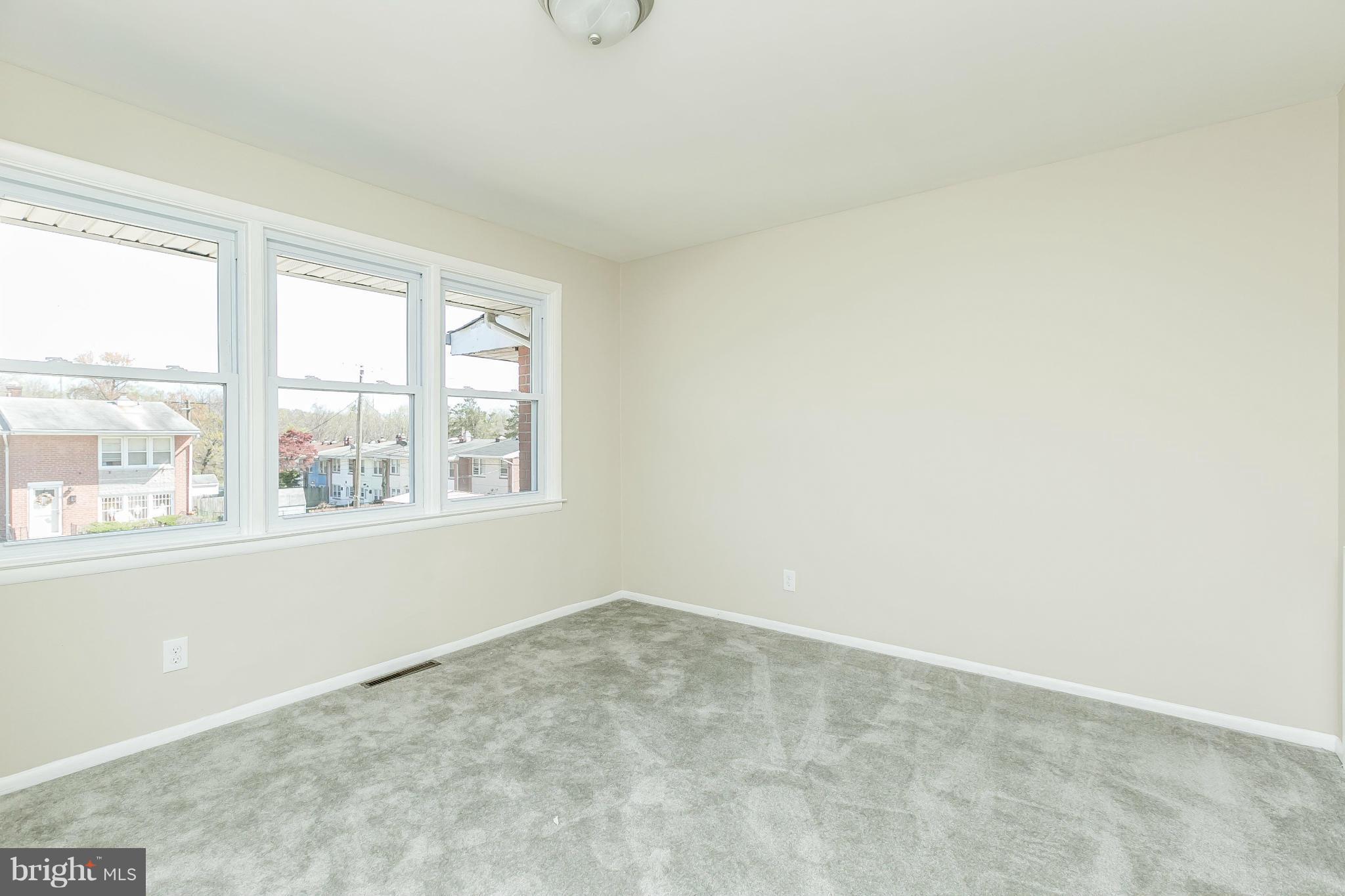 4802 Strathdale Road Baltimore, MD 21206 - Photo 11 of 23 an empty room with a window