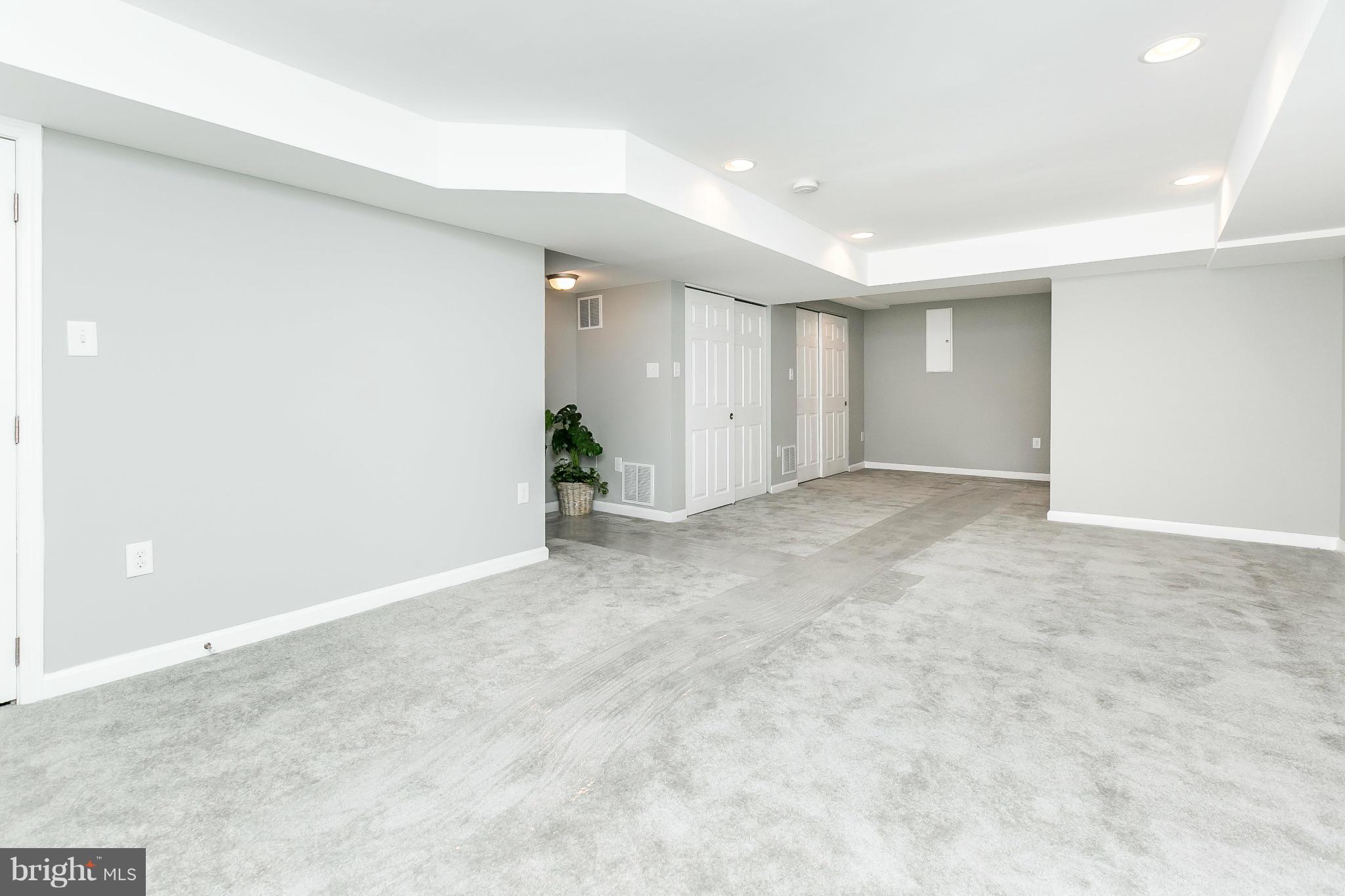 4802 Strathdale Road Baltimore, MD 21206 - Photo 16 of 23 an empty room with a natural light