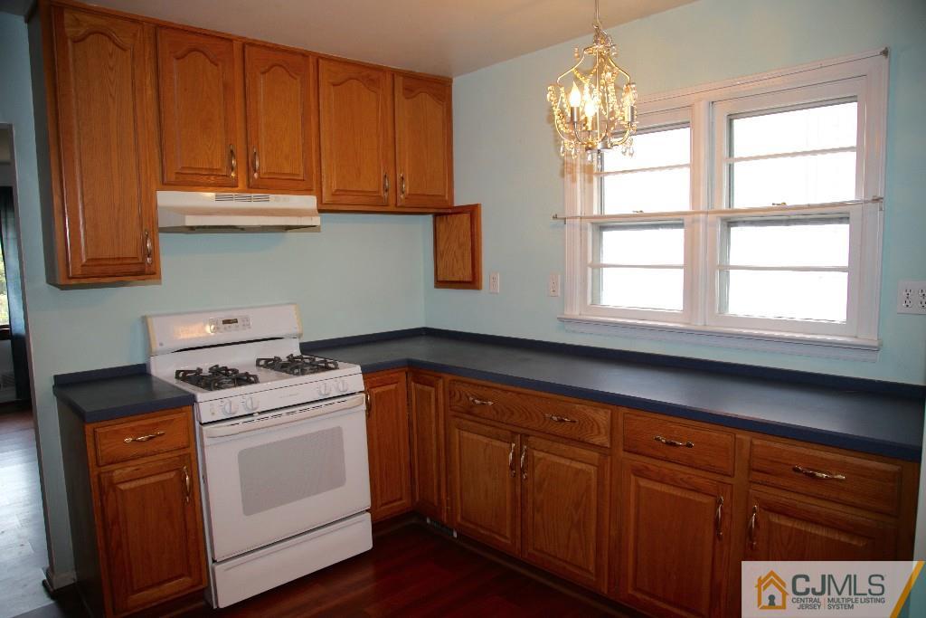 47 Caldwell Road Edison, NJ 08817 - Photo 4 of 14 a kitchen with granite countertop cabinets stainless steel appliances a sink and a window
