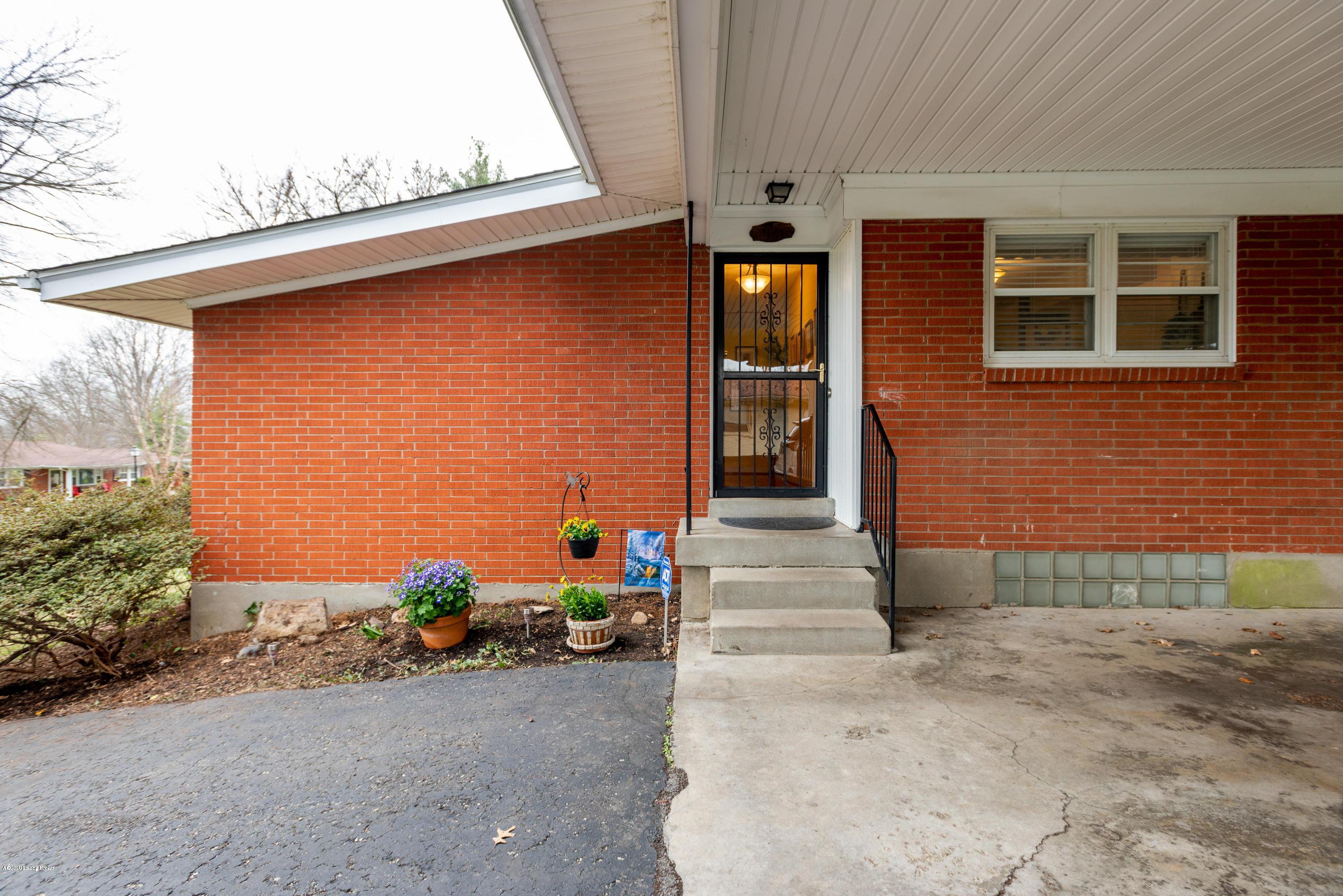 4705 Clarmar Road Louisville, KY 40299 - Photo 43 of 45 The driveway approaches the covered carport and provides extra parking for your guests