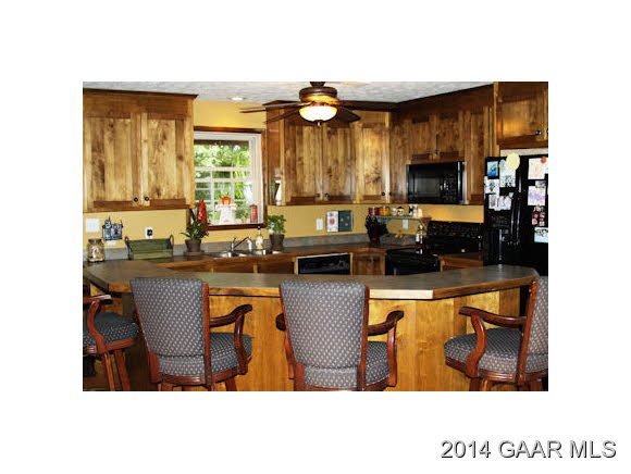 334 Rife's Ford Road Verona, VA 24482 - Photo 14 of 21 a kitchen with kitchen island granite countertop a sink cabinets and stainless steel appliances