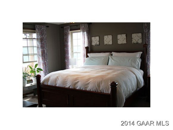 334 Rife's Ford Road Verona, VA 24482 - Photo 15 of 21 a bed sitting in a bedroom next to a window