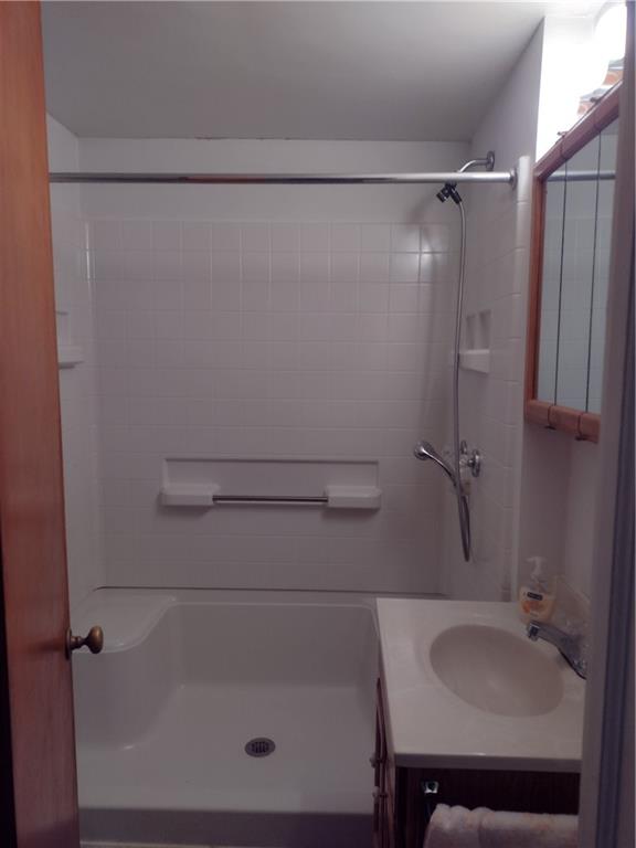 201 Glauser Lane Lower Burrell, PA 15068 - Photo 12 of 13 a bathroom with a shower and a sink