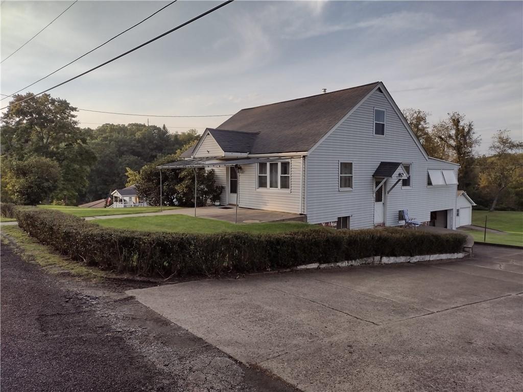 201 Glauser Lane Lower Burrell, PA 15068 - Photo 2 of 13 a front view of a house with a yard