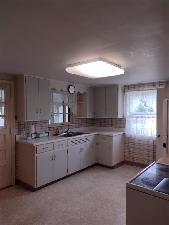 201 Glauser Lane Lower Burrell, PA 15068 - Photo 4 of 13 a kitchen with sink and cabinet