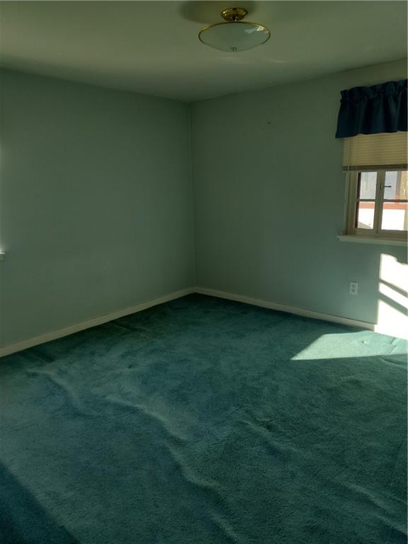 201 Glauser Lane Lower Burrell, PA 15068 - Photo 8 of 13 a view of an empty room and window