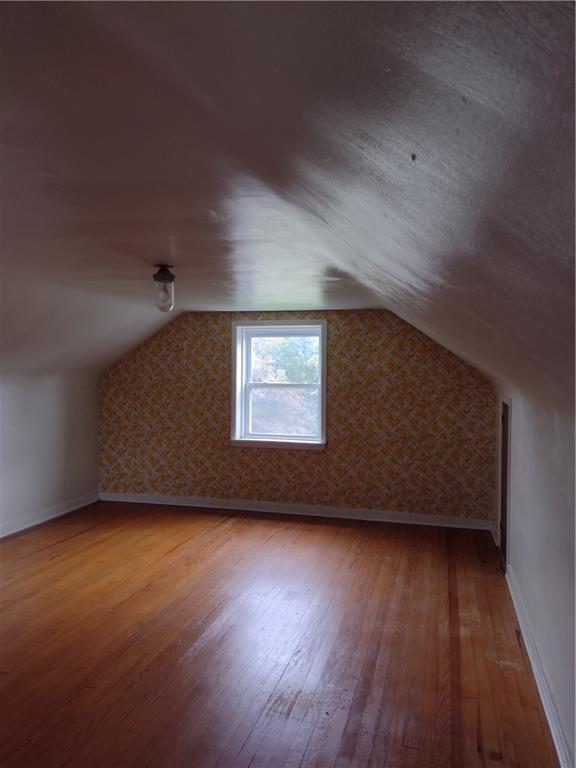 201 Glauser Lane Lower Burrell, PA 15068 - Photo 9 of 13 an empty room with wooden floor and windows