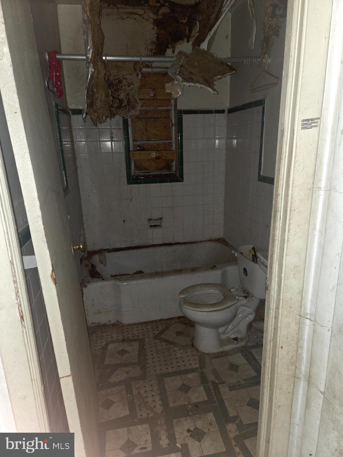 4639 Hillside Road Southeast Washington, DC 20019 - Photo 18 of 23 a bathroom with a toilet and a shower