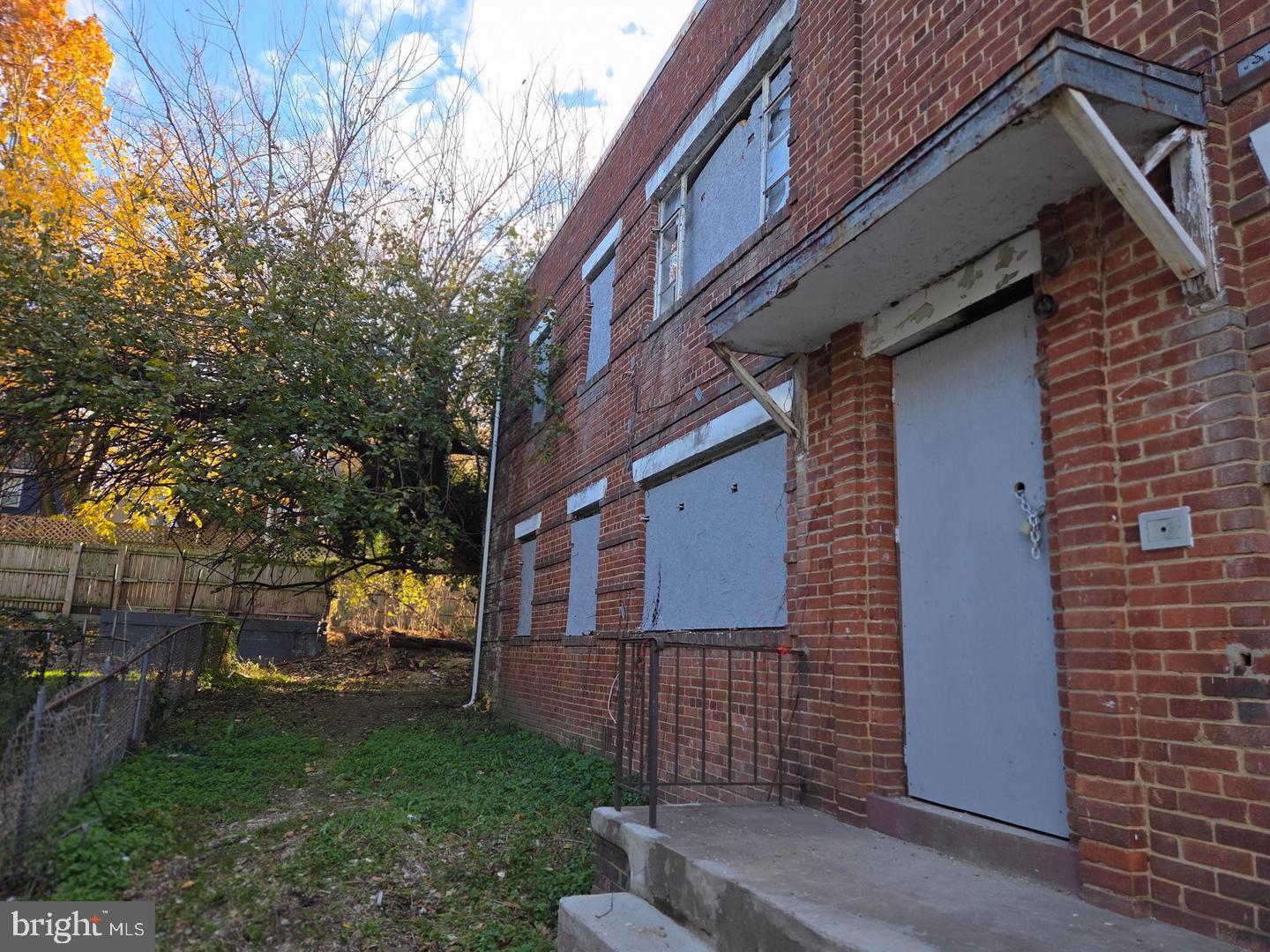 4639 Hillside Road Southeast Washington, DC 20019 - Photo 3 of 23 a view of a building with a yard